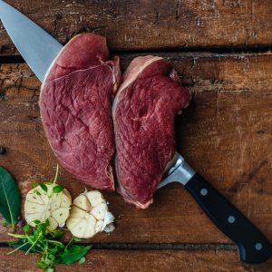 Raw venison steak